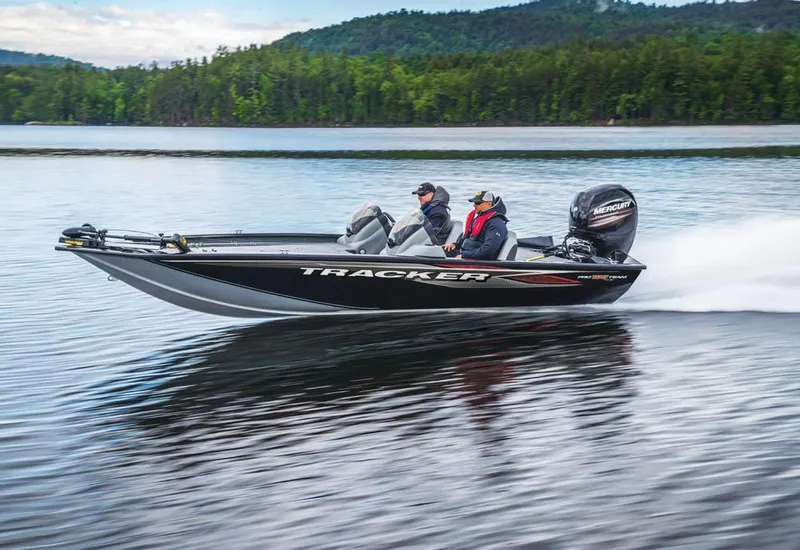 Slide: The Image of 2020 Tracker Pro Team 195 TXW boat interior with steering console and seating. - 3