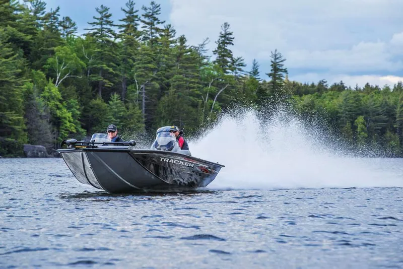 Slide: The Image of 2020 Tracker Pro Team 195 TXW boat dashboard with steering wheel and electronic display. - 4