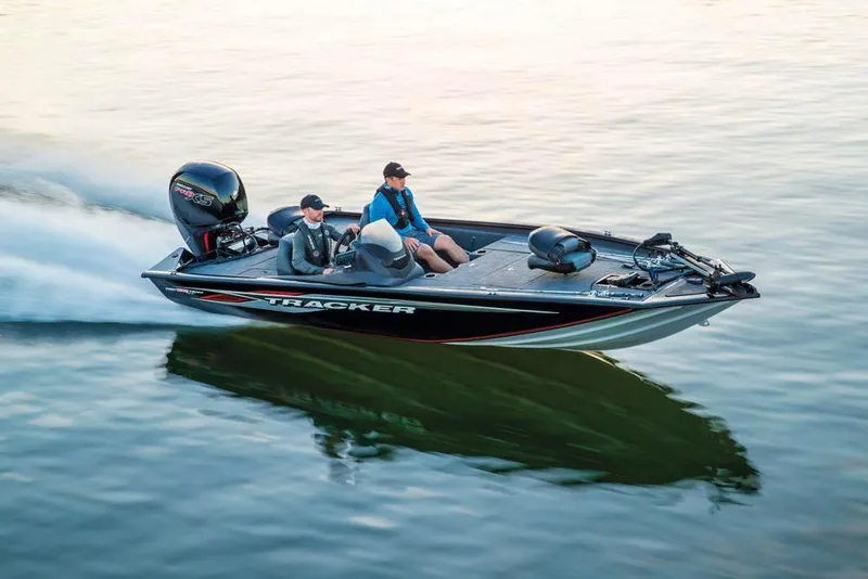 Slide: The Image of 2020 Tracker Pro Team 195 TXW boat on trailer in outdoor setting. - 6