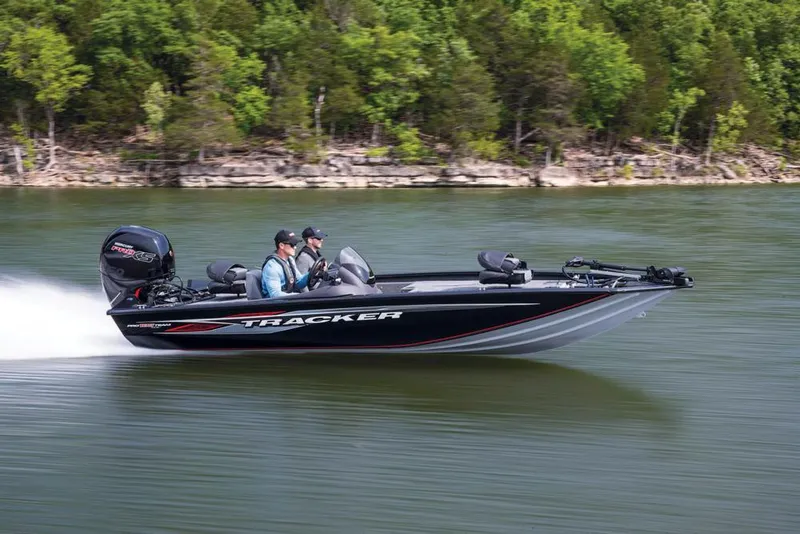 Slide: The Image of 2020 Tracker Pro Team 195 TXW boat with Mercury 150 engine, parked outdoors. - 8