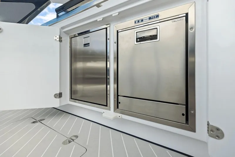 Slide: The Image of 2026 Azimut Verve 48 yacht interior with stainless steel appliances and sleek design. - 17