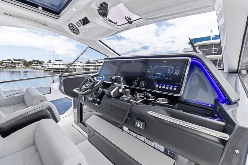 Slide: The Image of 2026 Azimut Verve 48 yacht cockpit with advanced navigation controls and luxurious seating. - 19
