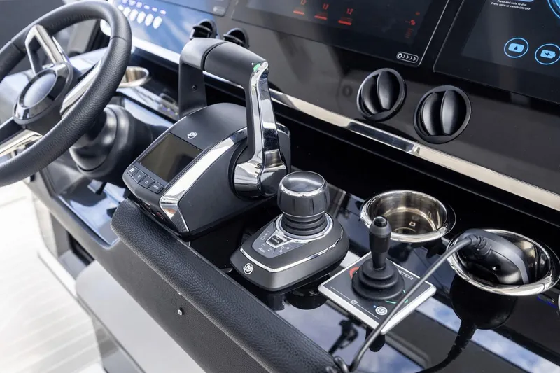Slide: The Image of Control panel of 2026 Azimut Verve 48 yacht with steering wheel and joysticks. - 20