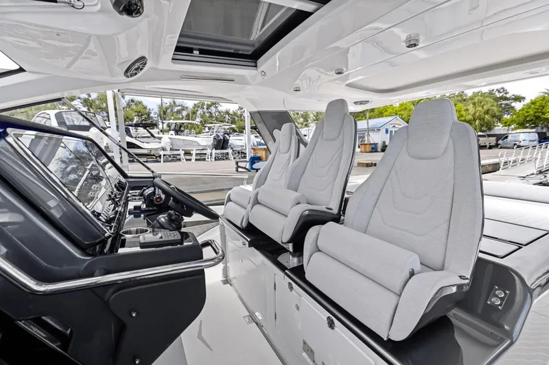 Slide: The Image of Interior of 2026 Azimut Verve 48 yacht with modern helm and seating. - 22