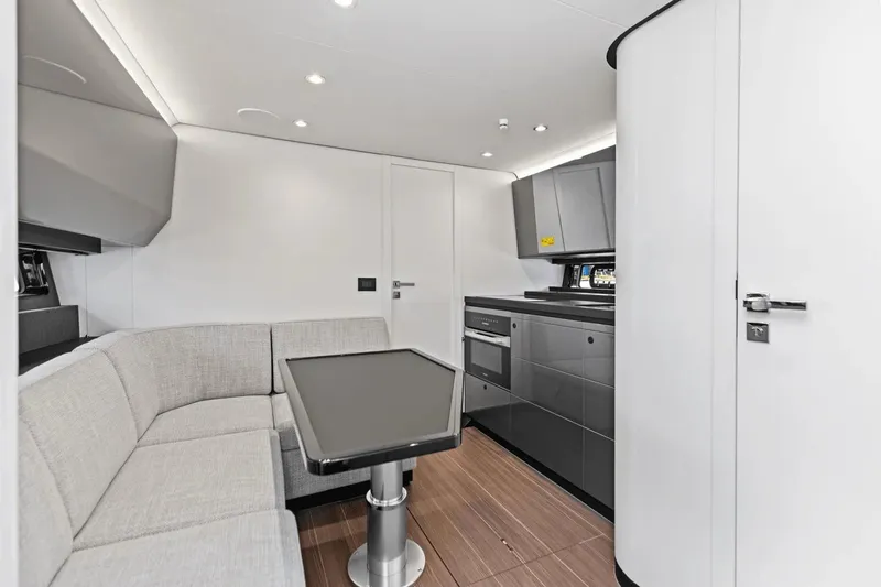 Slide: The Image of Modern interior of 2026 Azimut Verve 48 yacht with sleek kitchen and cozy seating area. - 26