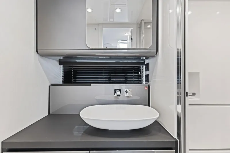 Slide: The Image of Modern bathroom interior of 2026 Azimut Verve 48 yacht with sleek sink and mirror. - 34