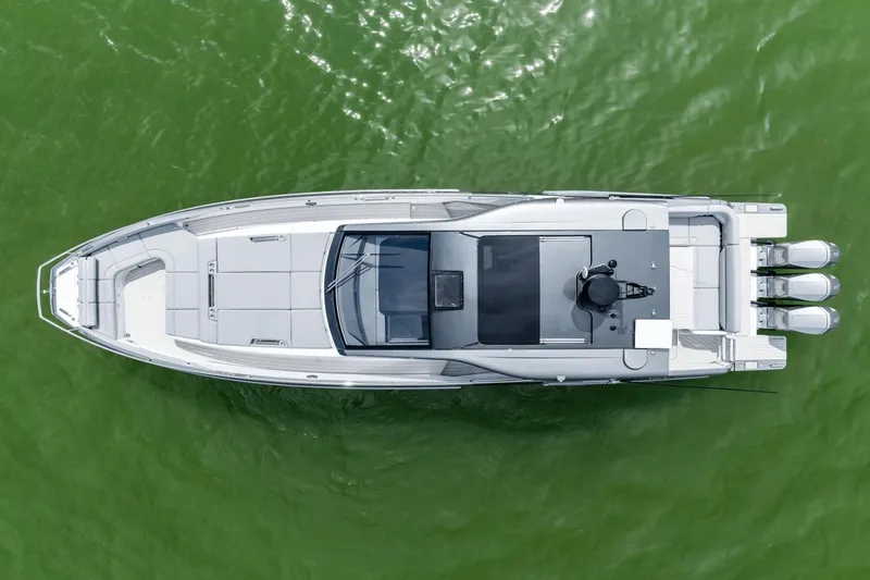 Slide: The Image of Top view of 2026 Azimut Verve 48 yacht on green water. - 38
