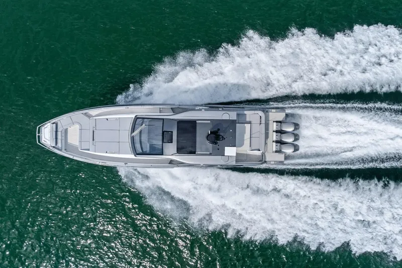 Slide: The Image of 2026 Azimut Verve 48 yacht cruising on open water, aerial view. - 4