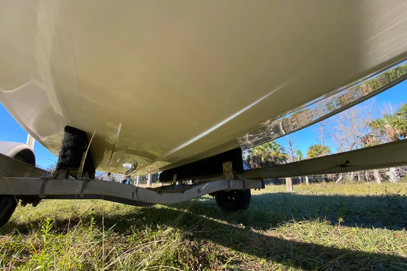 Slide: The Image of Rear view of 1999 Silver King Signature 16 boat with motor and trim tab. - 11