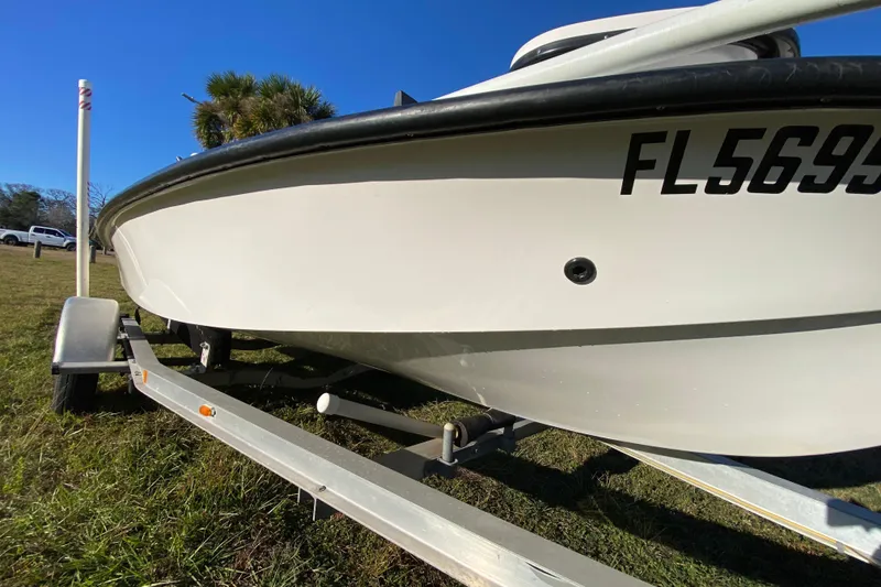 Slide: The Image of Underside view of a 1999 Silver King Signature 16 boat on a trailer. - 12