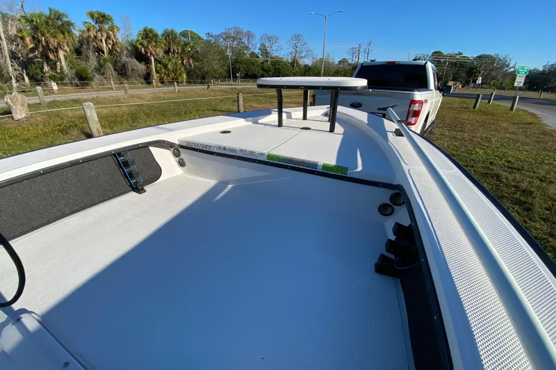 Slide: The Image of 1999 Silver King Signature 16 boat deck with textured surface and metal fittings. - 20