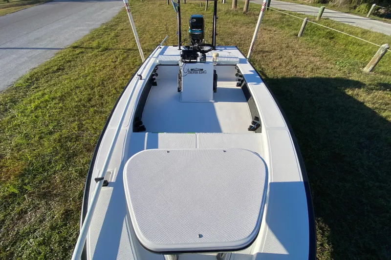 Slide: The Image of 1999 Silver King Signature 16 boat deck with textured surface and black supports. - 22