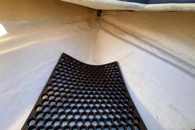 Slide: The Image of 1999 Silver King Signature 16 boat interior with textured flooring and rod holders. - 27