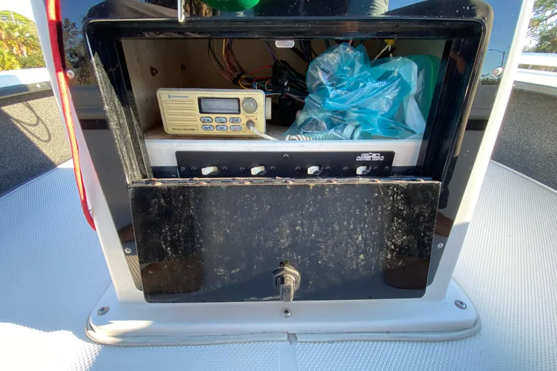 Slide: The Image of Open storage compartment on a 1999 Silver King Signature 16 boat, showing interior space. - 39