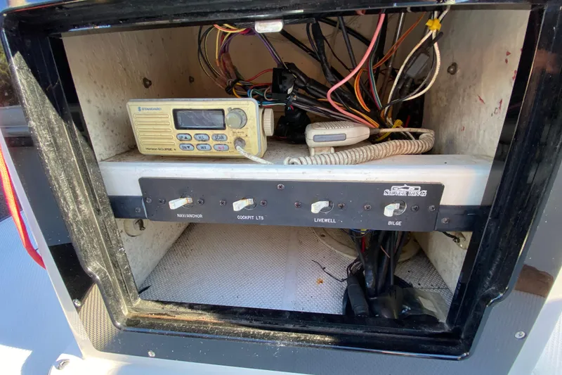 Slide: The Image of 1999 Silver King Signature 16 boat deck with textured surface and storage hatches. - 40