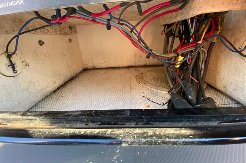 Slide: The Image of Open storage compartment on 1999 Silver King Signature 16 boat deck. - 41