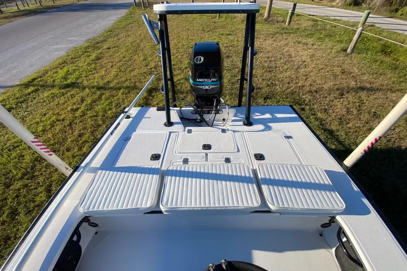 Slide: The Image of Livewell interior of a 1999 Silver King Signature 16 boat, showing plumbing and drain. - 42