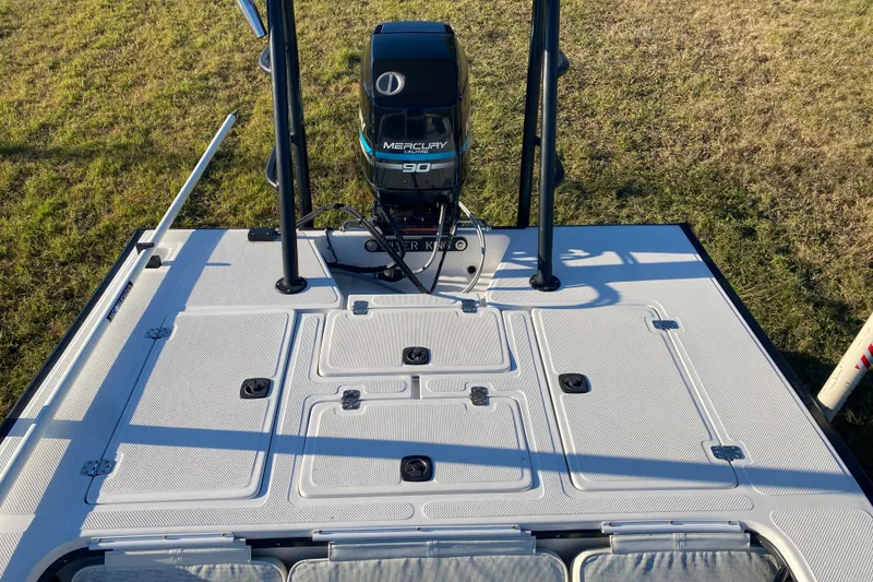 Slide: The Image of 1999 Silver King Signature 16 boat deck with textured surface and metal hinges. - 43