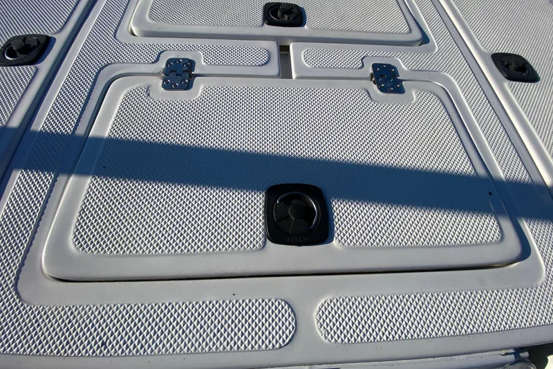 Slide: The Image of Open hatch on 1999 Silver King Signature 16 boat revealing battery compartment. - 46