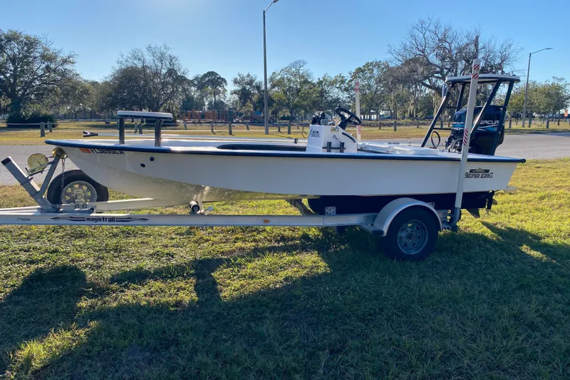 Slide: The Image of 1999 Silver King Signature 16 boat on trailer, Florida registration, sunny day. - 5