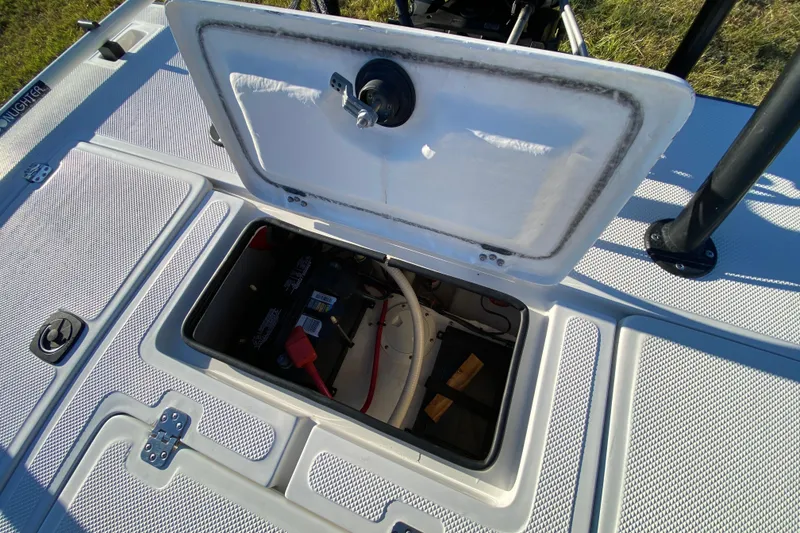 Slide: The Image of 1999 Silver King Signature 16 boat, top view, on grass, showcasing deck and steering console. - 52