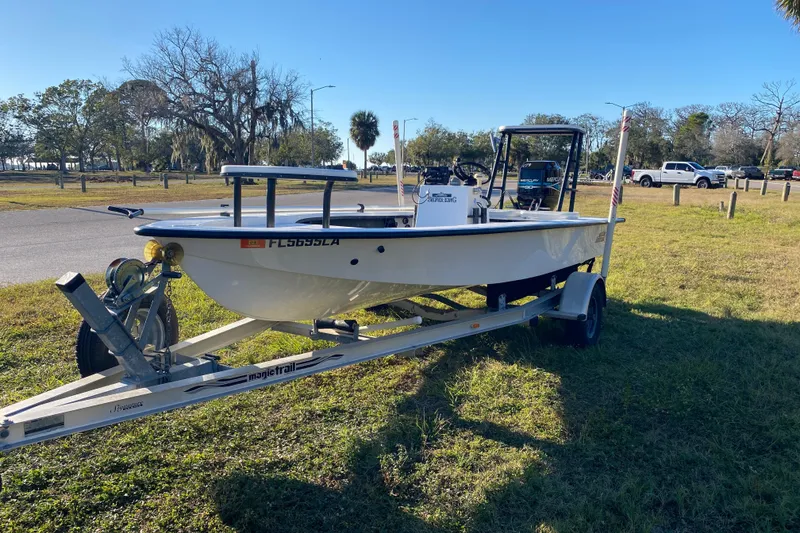 Slide: The Image of 1999 Silver King Signature 16 boat on trailer, close-up view, sunny day. - 6