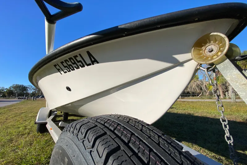 Slide: The Image of 1999 Silver King Signature 16 boat on trailer, side view with registration number. - 9