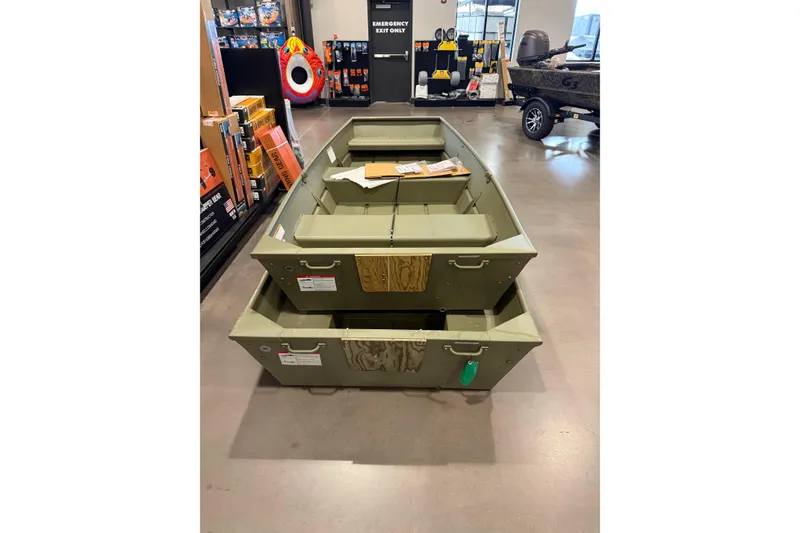 Slide: The Image of 2025 Crestliner 1040 CR Jon boat displayed in a showroom, featuring a durable design. - 4