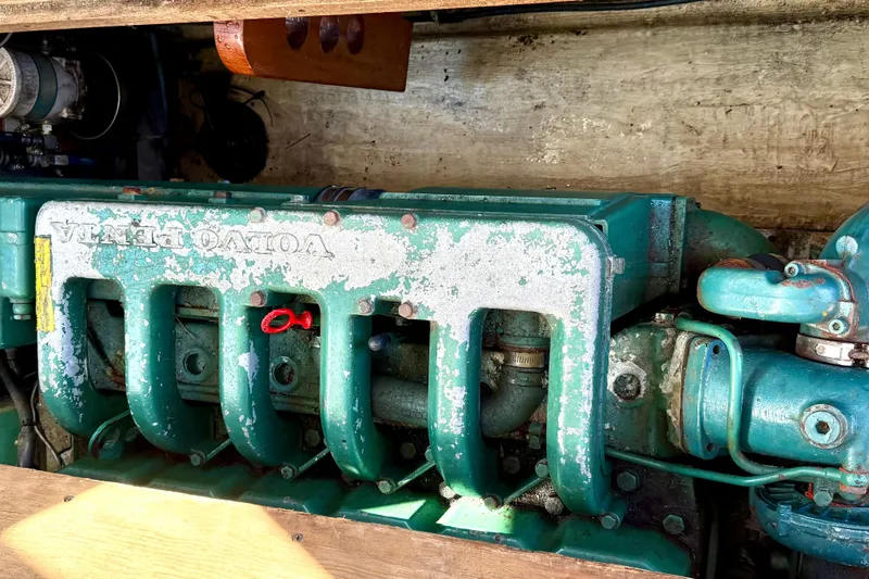 Slide: The Image of Engine of 1985 Cape Dory 28 Power Yacht, featuring a Volvo Penta motor. - 17