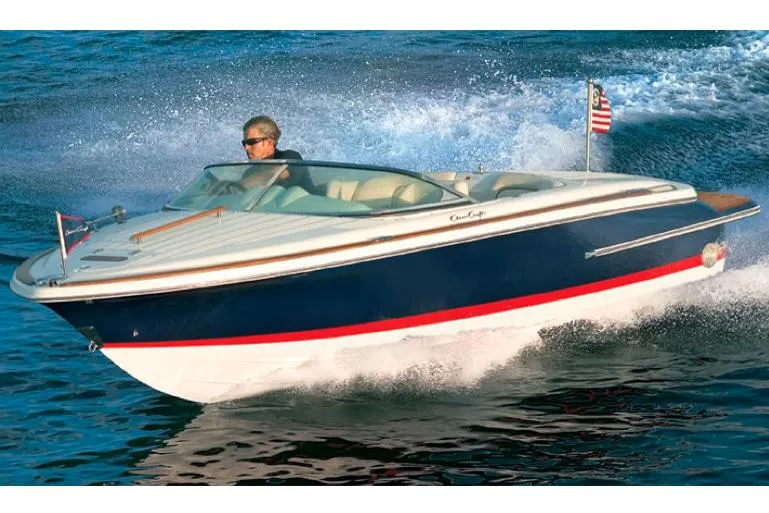 Slide: The Image of Manufacturer Provided Image: 2015 Chris-Craft Lancer 20 speedboat cruising on water. - 4