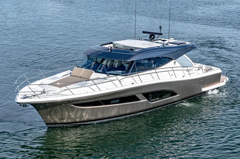 The Image of 2024 Riviera 465 SUV luxury yacht cruising on water. - 0