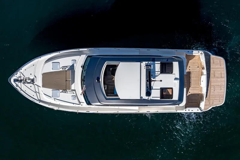 Slide: The Image of Top view of 2024 Riviera 465 SUV luxury yacht on water. - 13