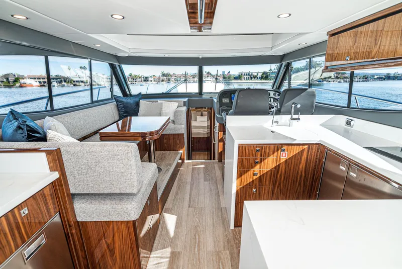 Slide: The Image of 2024 Riviera 465 SUV interior with modern design, spacious seating, and panoramic windows. - 27