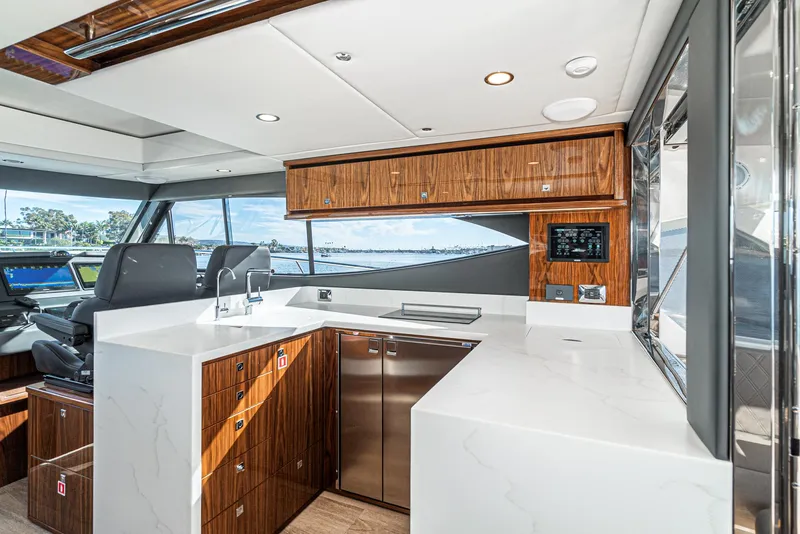Slide: The Image of 2024 Riviera 465 SUV yacht interior with modern kitchen and sleek design. - 30