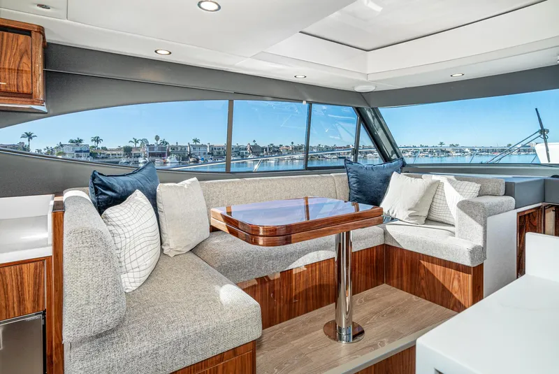 Slide: The Image of Luxurious interior of 2024 Riviera 465 SUV yacht with panoramic windows and plush seating. - 32