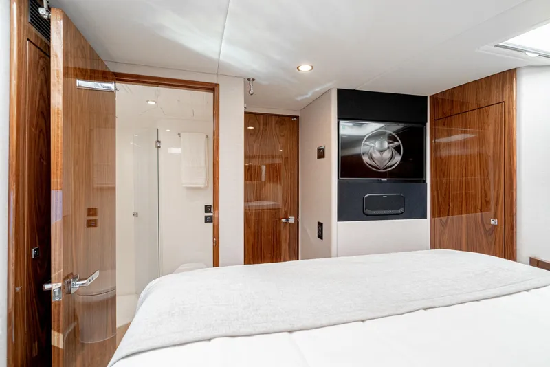 Slide: The Image of 2024 Riviera 465 SUV yacht interior bedroom with ensuite bathroom. - 37