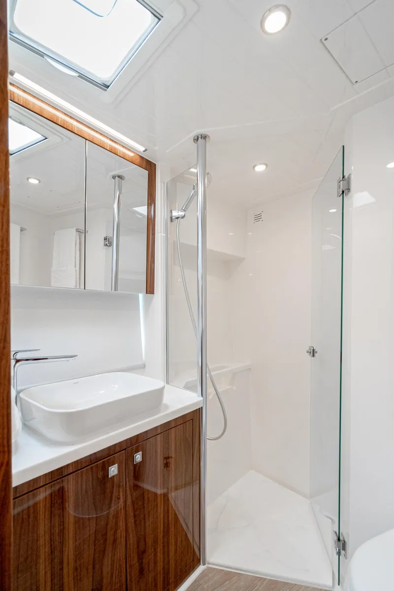 Slide: The Image of Luxurious bathroom in 2024 Riviera 465 SUV yacht with modern fixtures. - 39