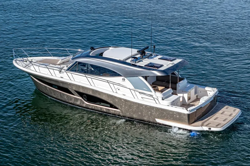 Slide: The Image of 2024 Riviera 465 SUV luxury yacht cruising on open water. - 4
