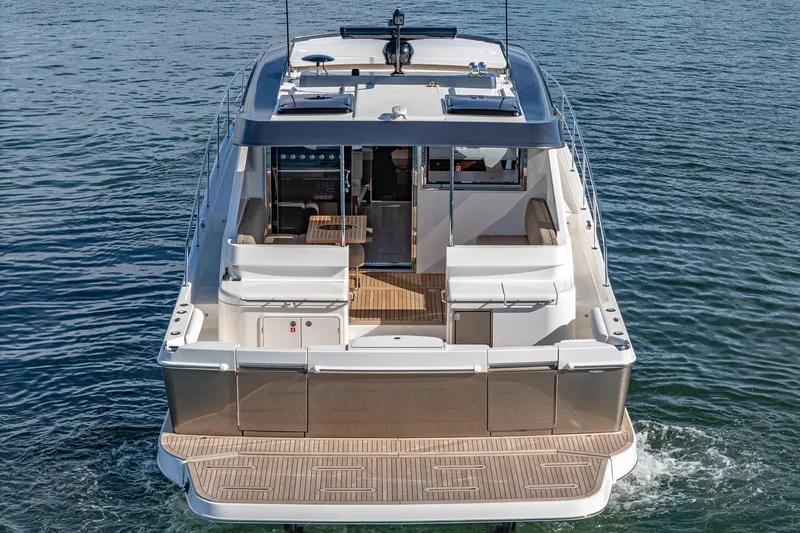 Slide: The Image of 2024 Riviera 465 SUV luxury yacht on water, rear view. - 5