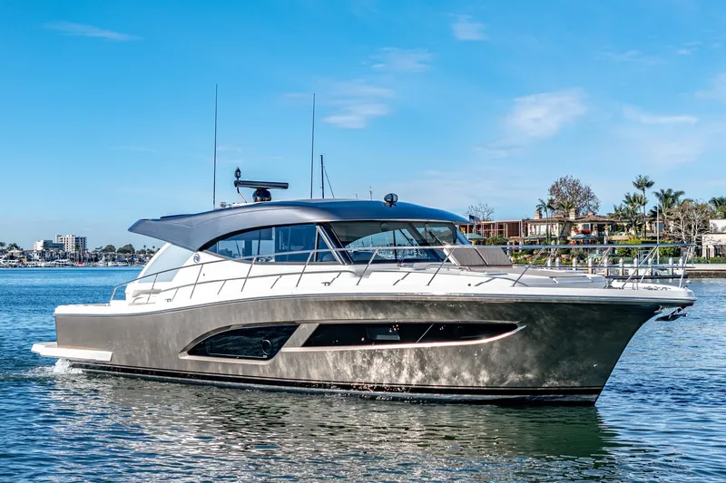 Slide: The Image of 2024 Riviera 465 SUV luxury yacht cruising on a sunny day. - 8