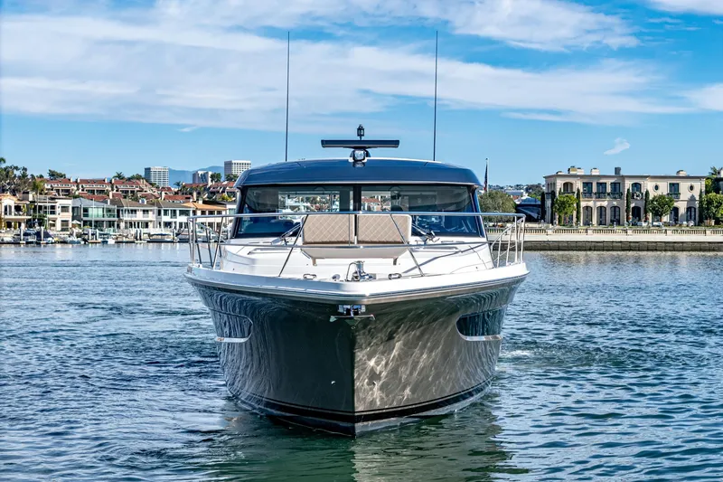 Slide: The Image of 2024 Riviera 465 SUV luxury yacht on water with scenic background. - 9