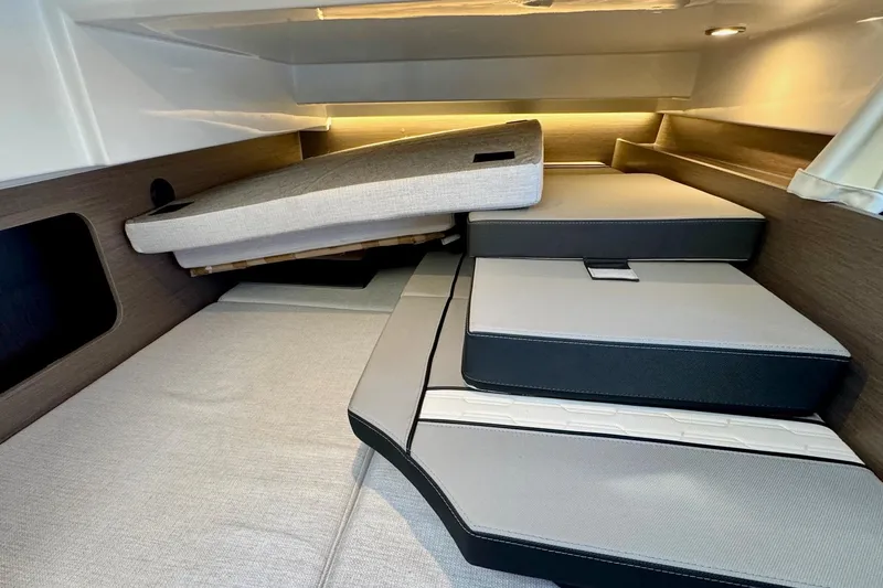 Slide: The Image of 2024 Jeanneau NC 1095 Coupe Series 2 cabin interior with adjustable cushions. - 17