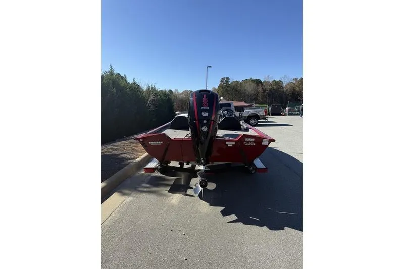 Slide: The Image of 2020 Tracker Pro Team 195 TXW boat with outboard motor in parking lot. - 11