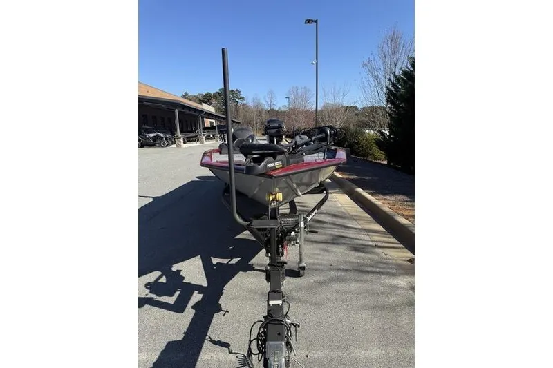 Slide: The Image of 2020 Tracker Pro Team 195 TXW boat on trailer in parking lot. - 12