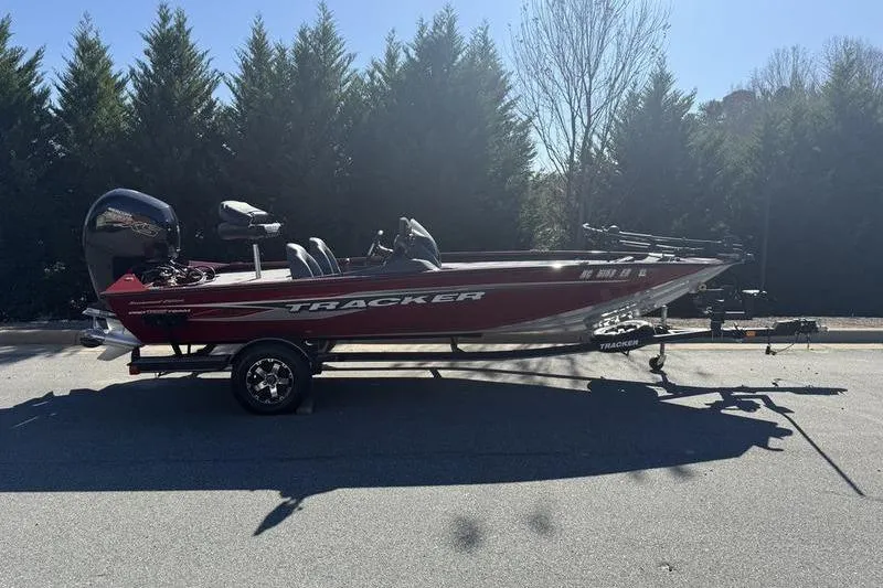 Slide: The Image of 2020 Tracker Pro Team 195 TXW boat on trailer, parked outdoors. - 15