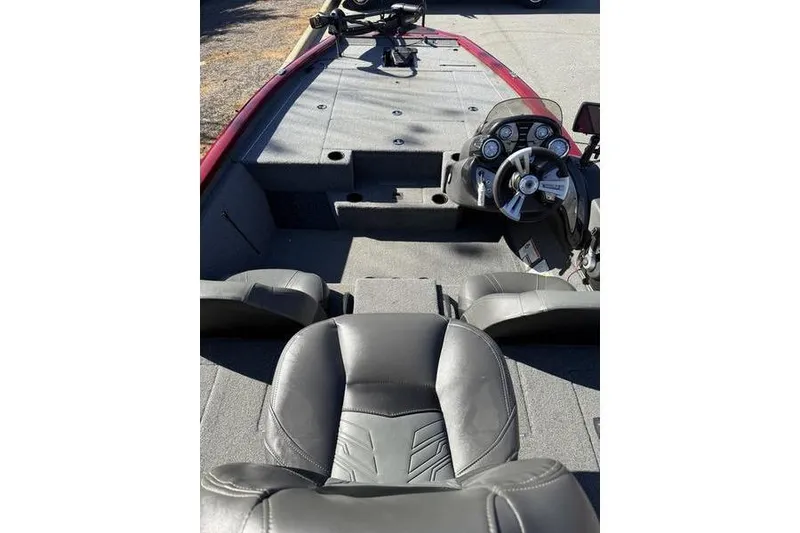 Slide: The Image of 2020 Tracker Pro Team 195 TXW boat interior with steering console and seating. - 9