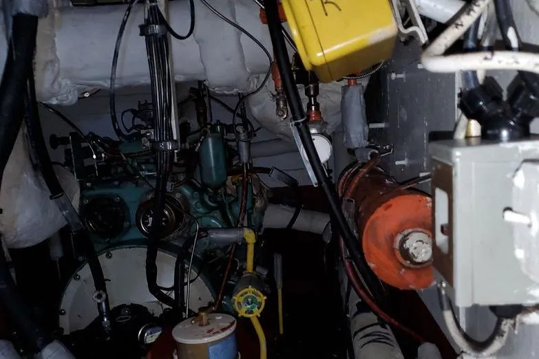 Slide: The Image of Engine room of 1970 COMMERICAL BOAT LCU-135, showcasing mechanical components and wiring. - 12