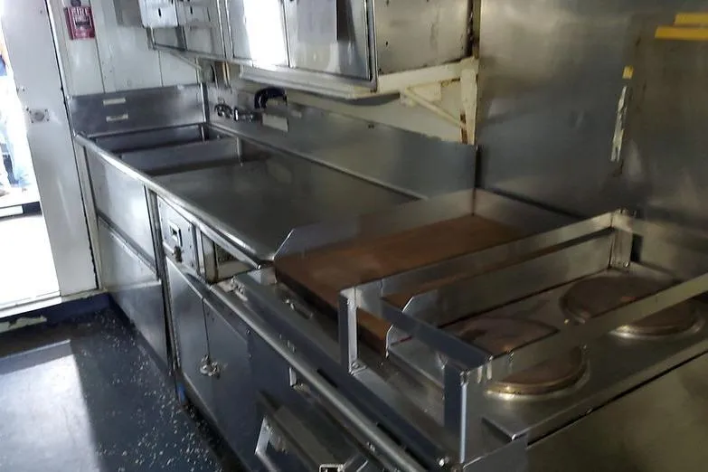 Slide: The Image of Commercial boat kitchen with stainless steel appliances, LCU-135 model, 1970. - 15