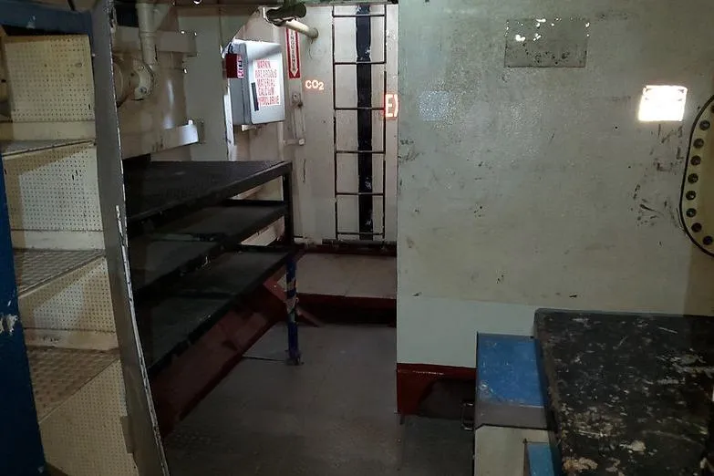 Slide: The Image of Interior of 1970 COMMERICAL BOAT LCU-135, featuring metal shelves and industrial design. - 16