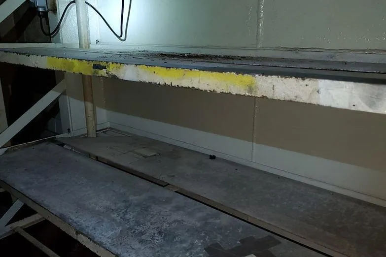 Slide: The Image of Interior of 1970 COMMERICAL BOAT LCU-135 showing metal shelving and electrical wiring. - 22